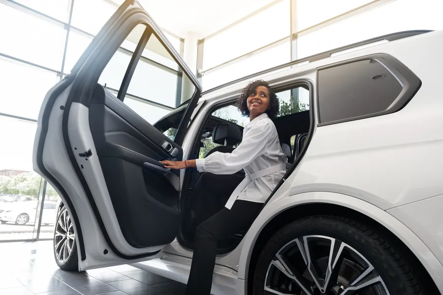 Passenger entering a premium SUV, illustrating executive mobility in Abuja